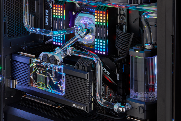 High-contrast close-up of computer graphics card water cooling system in testing rig